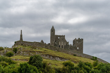 Fototapeta premium view of the historic Rock of Cashel in County Tipperary of Ireland under an overcast and stormy sky