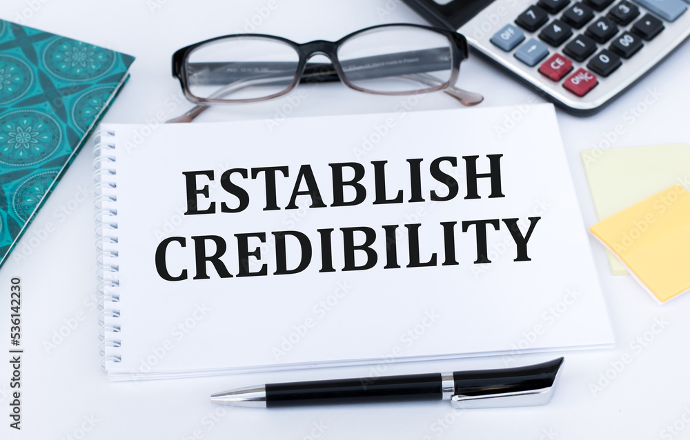 Poster establish credibility. text on an open notebook