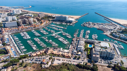 Beautiful aerial perspective of Vilamoura marina. Luxury hotels, yachts docked in the port. Famous...