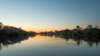 Naklejka na ściany i meble sunset on the river