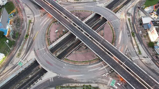 Expressway top view, Road traffic an important infrastructure, car traffic transportation above intersection , aerial view cityscape of advanced innovation, financial technology, 4k Hyperlapse