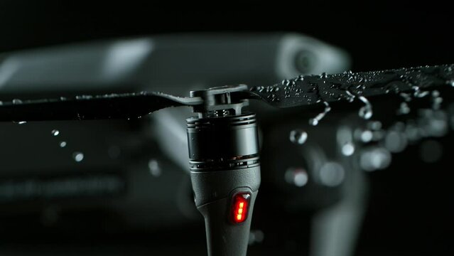 Close-up shot of a modern drone motor with water drops. Slow motion shot filmed on high speed cinematic camera at 1000 fps.