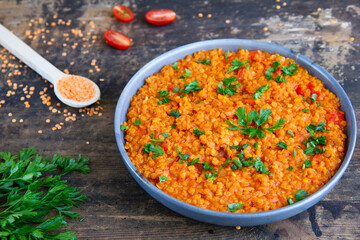 Red lentil dish with tomatoes and peppers. Vegetarian cooking
