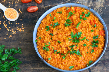 Red lentil dish with tomatoes and peppers. Vegetarian cooking
