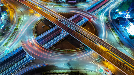 Expressway top view, Road traffic an important infrastructure, car traffic transportation above intersection road, aerial view cityscape of advanced innovation, financial technology