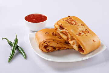 Chicken roll isolated on white with sauce