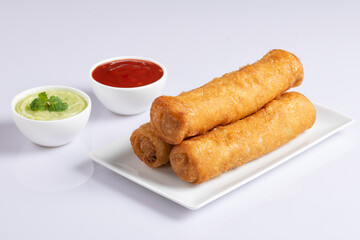 Chicken roll isolated on white with sauce