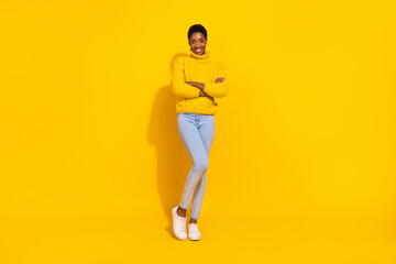 Fototapeta na wymiar Full length body size view of attractive cheerful slim fit skinny girl folded arms isolated over bright yellow color background