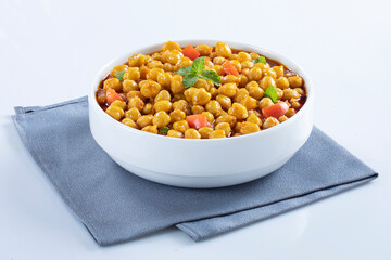 Indian style crispy roasted chickpeas in bowls over white background. Vegetarian vegan food concept. Top view, flat lay