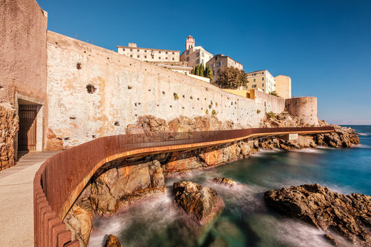 The L'Aldilonda walkway along the rocky east coast and city wall below the citadel of Bastia on the east coast of Corsica