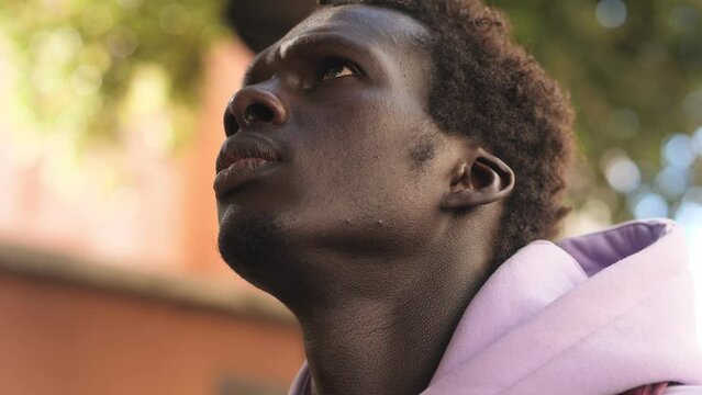 Missing africa, refugees concept. Black migrant opening his eye