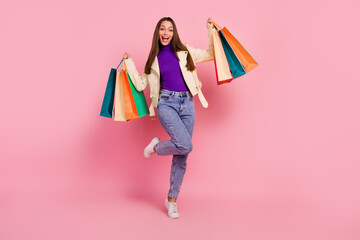 Full body photo of nice brunette millennial lady buy stuff yell wear trendy cloth shoes isolated on pink color background