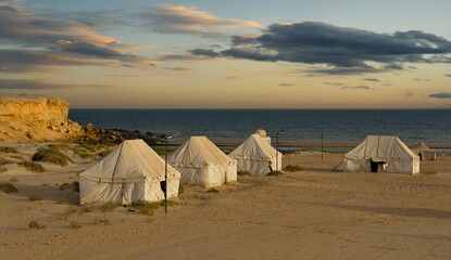 West Africa. Mauritania A picturesque twilight evening at a tent campsite on the Atlantic Ocean in...