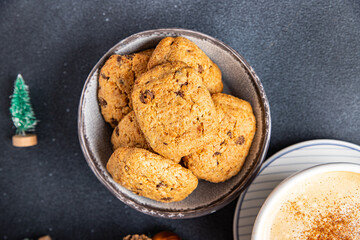 festive christmas cookie chocolate drops, cinnamon, ginger new year sweet dessert home food snack on the table copy space food background