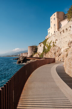The L'Aldilonda walkway along the rocky east coast and city wall below the citadel of Bastia on the east coast of Corsica