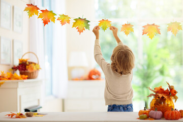 Autumn home decoration. Family decorating house.