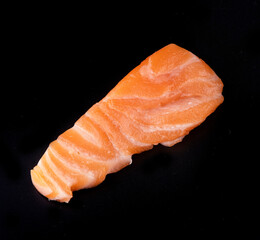 one piece raw salmon sashimi japanese food isolated on black background top view