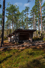 Leikkistenkangas traditional wooden Lean-To shelter and campfire site in Lauhanvuori National Park, Finland on a sunny day in autumn