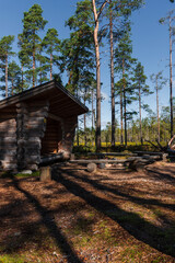 Leikkistenkangas traditional wooden Lean-To shelter and campfire site in Lauhanvuori National Park, Finland on a sunny day in autumn