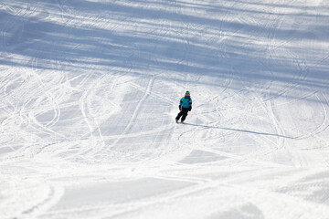 A child while skiing in a ski resort.