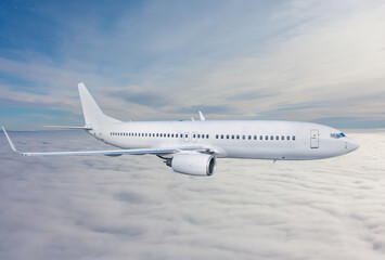 White passenger airplane fly in the air above the clouds