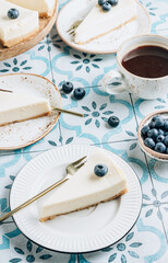 Cheesecake with blueberries on white plate. Classical New York cheesecake.
