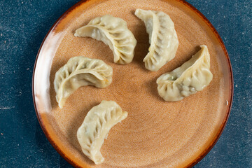 Steamed chicken mom wrap with ketchup served in a dish isolated on background top view