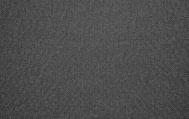 Fototapeta na wymiar Texture of black dense woven fabric.Background of black dense textiles.Black fabric surface.