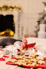 Christmas cookies with Christmas decorations on the bed in the interior