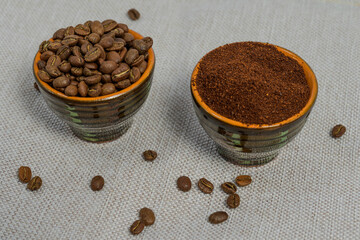 Ground and whole-grain coffee on a light background.