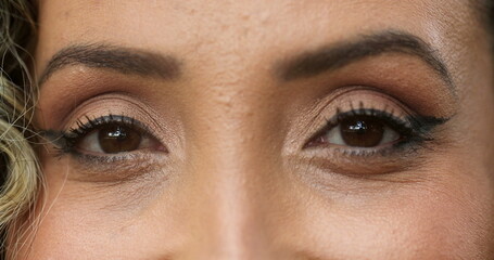Hispanic latina woman macro close-up eyes staring at camera