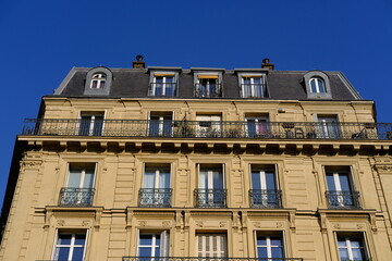 Paris, France - March, 26th 2022: Some traditional buildings in Paris center. (district: le Marais).