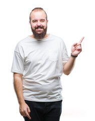 Young caucasian hipster man wearing casual t-shirt over isolated background with a big smile on face, pointing with hand and finger to the side looking at the camera.