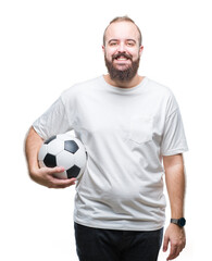 Young caucasian hipster man holding soccer football ball over isolated background with a happy face standing and smiling with a confident smile showing teeth