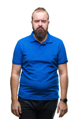 Young caucasian hipster man wearing blue shirt over isolated background depressed and worry for distress, crying angry and afraid. Sad expression.