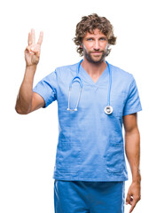 Handsome hispanic surgeon doctor man over isolated background showing and pointing up with fingers number three while smiling confident and happy.