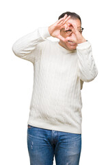 Fototapeta premium Middle age arab man wearing glasses over isolated background Doing heart shape with hand and fingers smiling looking through sign