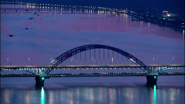 time lapse aerial view of suspension over qiantang river at twilight