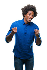 Afro american man over isolated background very happy and excited doing winner gesture with arms...