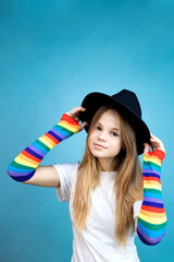 Girl in a hat shows different emotions on a blue background