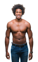 Fototapeta premium Afro american shirtless man showing nude body over isolated background with a happy and cool smile on face. Lucky person.