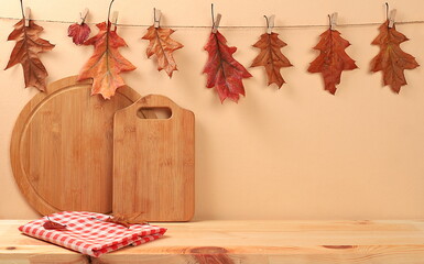Empty wooden table with kitchen utensils and maple leaves,eco concept,kitchen mockup for design and...