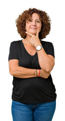 Beautiful middle ager senior woman over isolated background looking confident at the camera with...