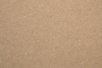 Background - mdf board texture which is brownish yellow in color.