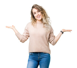 Beautiful young blonde woman wearing sweatershirt over isolated background Smiling showing both...