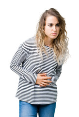Beautiful young blonde woman wearing stripes sweater over isolated background with hand on stomach because nausea, painful disease feeling unwell. Ache concept.