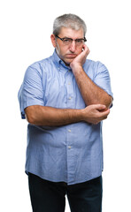 Fototapeta premium Handsome senior man wearing glasses over isolated background thinking looking tired and bored with depression problems with crossed arms.