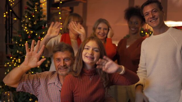 A group of multi ethnic. Portrait of Caucasian and African American black woman have a celebration in video call conference party on Merry Christmas Eve Xmas on holiday at home. People lifestyle.