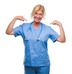 Middle age blonde nurse surgeon doctor woman over isolated background looking confident with smile...
