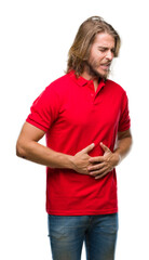 Young handsome man with long hair over isolated background with hand on stomach because indigestion, painful illness feeling unwell. Ache concept.